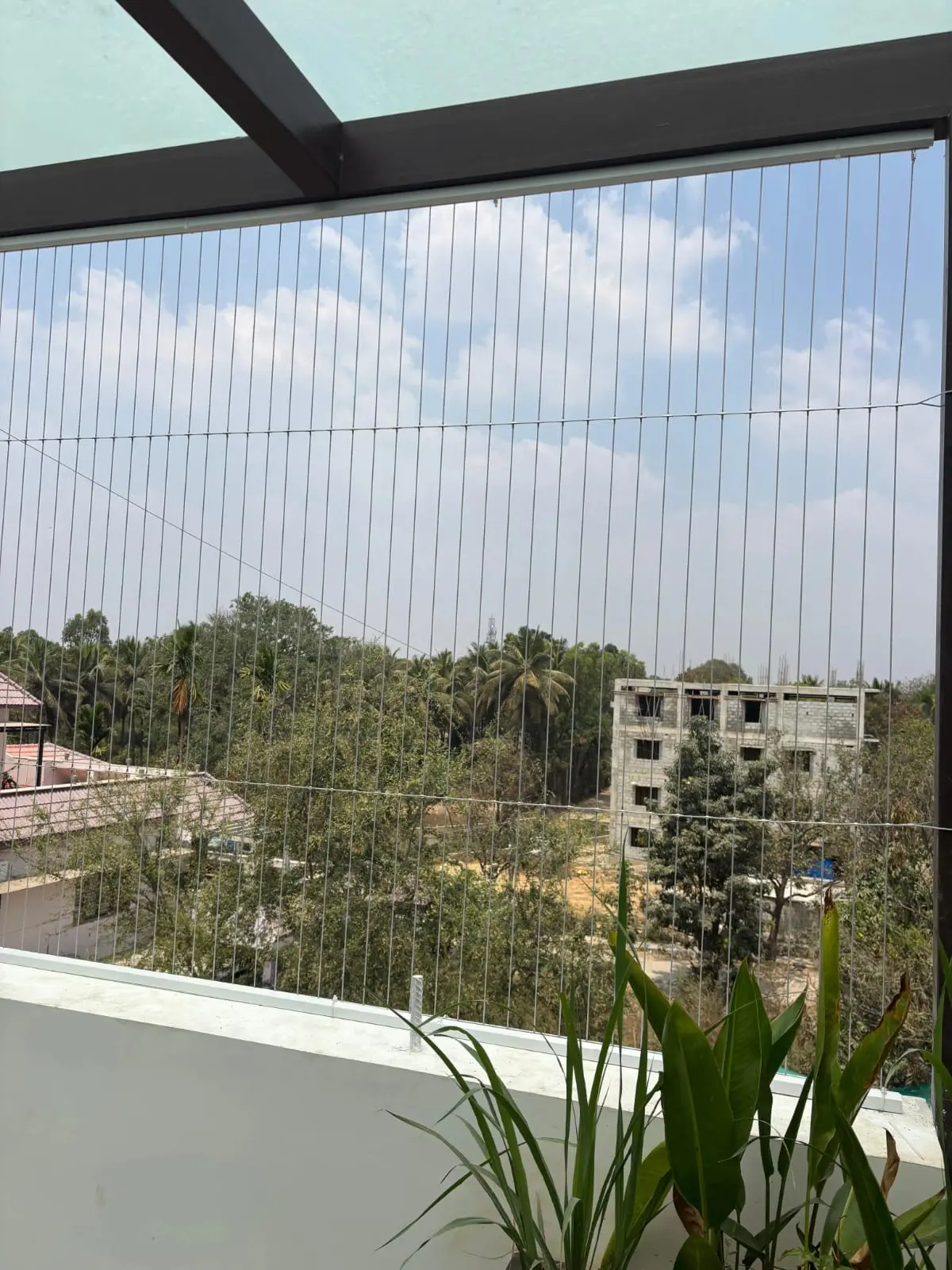 Architectural SS316 invisible grill installation on Bangalore apartment window
